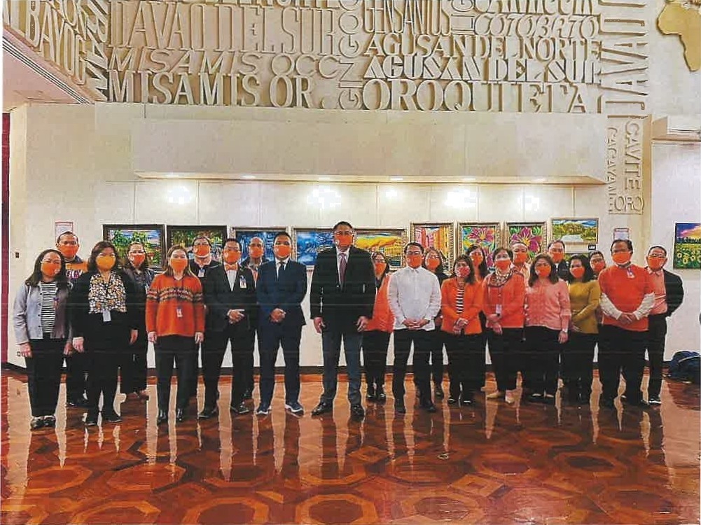group photo of NYPCG orange to end violence against women
