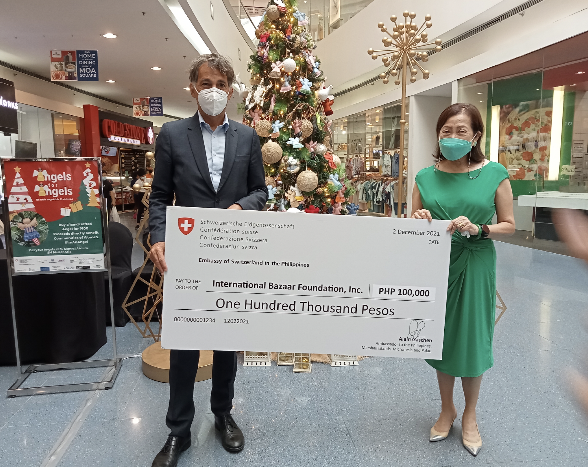 Swiss Embassy turns over cash donation 1