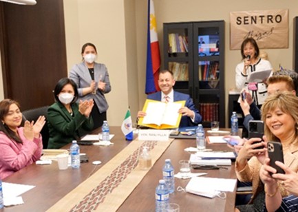 Minister Pillai presents the signed copy of the MOUjpg