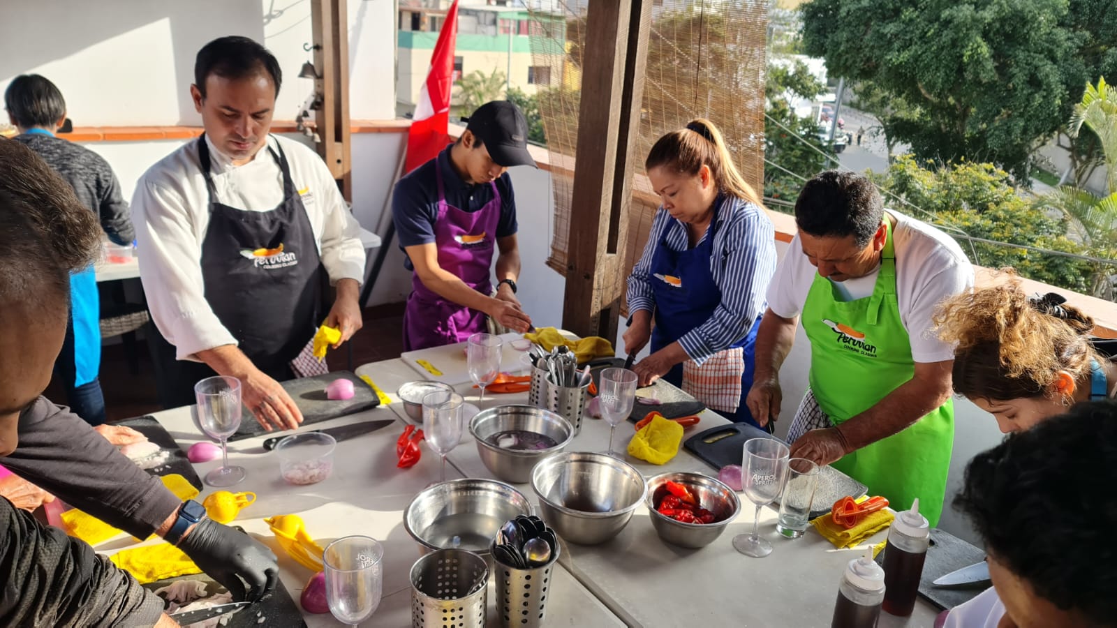 Filipino Chef Miguel Paolo Damatac third from the left in black and Peruvian Chef Héctor Aguilar Valle in black and white second from the left with participants of the Peruvian Cooking Classesjpg